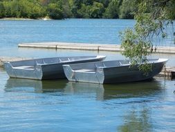 empty boats on lake at pier