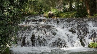 beautiful waterfall at the river stone monastery