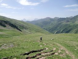 man alone rises uphill