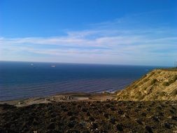 panorama of blue ocean from a cliff