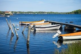 Boats near wooden pier Lake scene