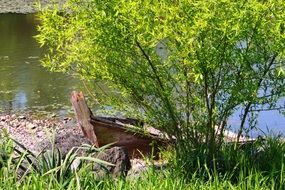 abandoned boat by the lake