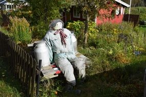 doll on a bench near a can of milk