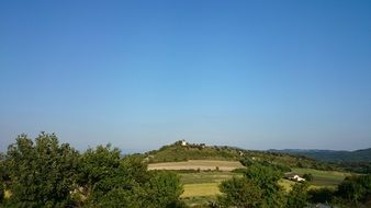 remote view of an old village on a hill