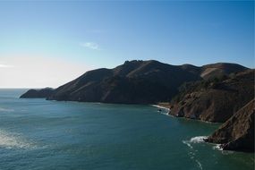 Landscape of mountains on a ocean coast