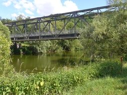 iron bridge over a narrow river