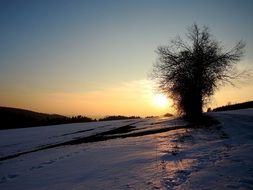 snow slope at sunset