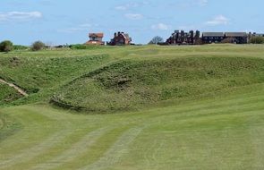 golf course with green grass on the hills