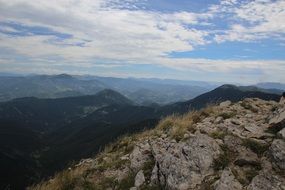 mountains under white clouds