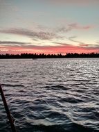 red sky over lake on horizon