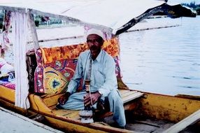man in white clothes on a boat
