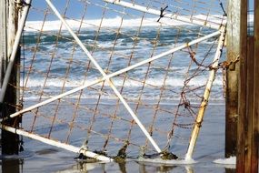 broken gate by the ocean