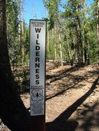 Sign in the national park in the forest
