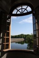 tranquil view from open lattice window