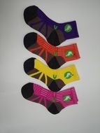four different colorful socks