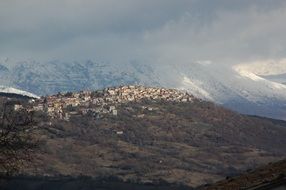 hilltop city panorama under gray sky