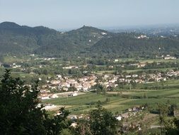 scenic countryside with fields among hills, italy