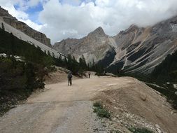 landscape of People on the road against the backdrop of picturesque dolomites