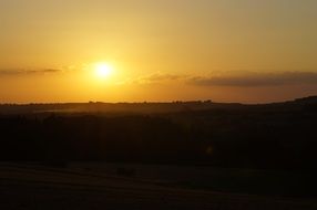 yellow sky at sunset over the mountains