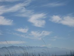 distant view of mountains in cloudy haze