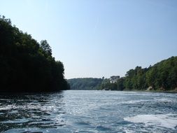 panorama of a river among green forests in Switzerland