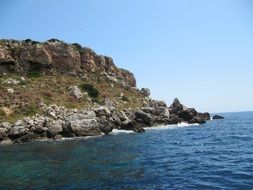 green rocky seashore