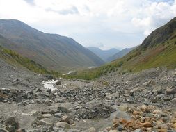 river at the foot of the mountains