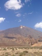 white clouds over the volcano el teide in tenerife