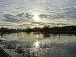 sunrise in the clouds over the river in Brda
