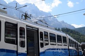 white-blue train on the railway