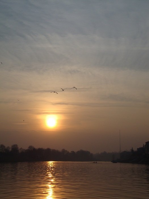 sunset over water at dusk