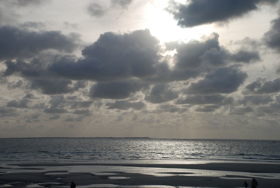Clouds and waves on the beach