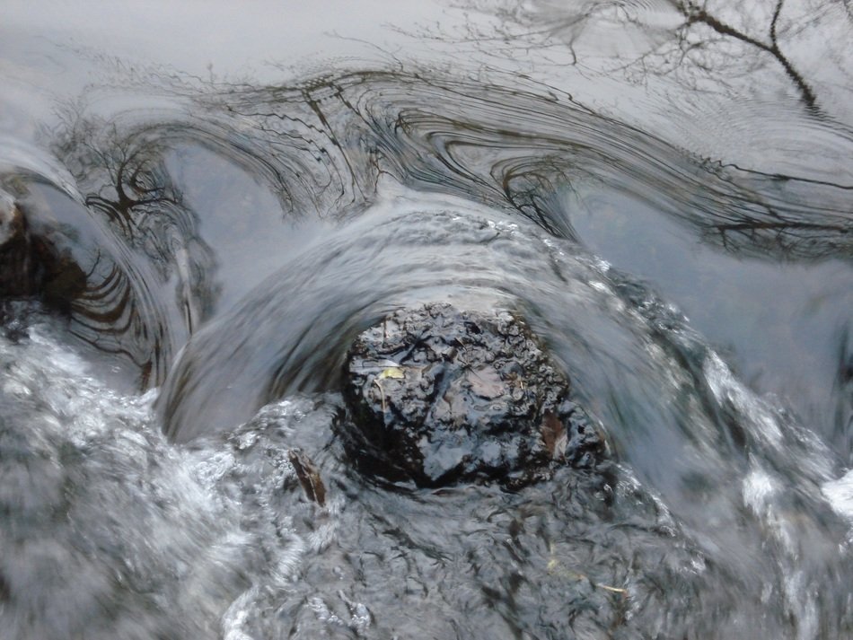 whirlwinds of mountain rock around stones