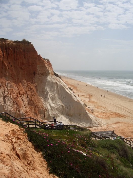 Red sand on the ocean coast