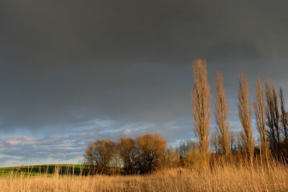 dark clouds above countryside at fall