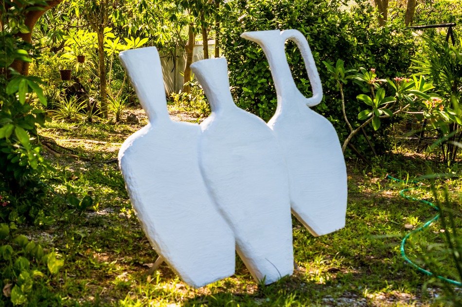white figures in the garden