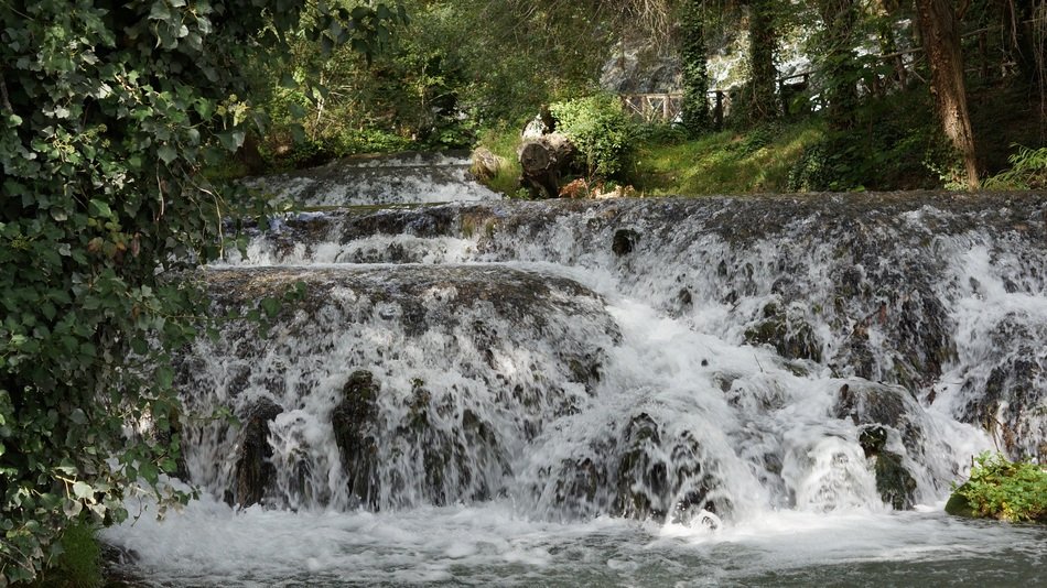 beautiful waterfall at the river stone monastery