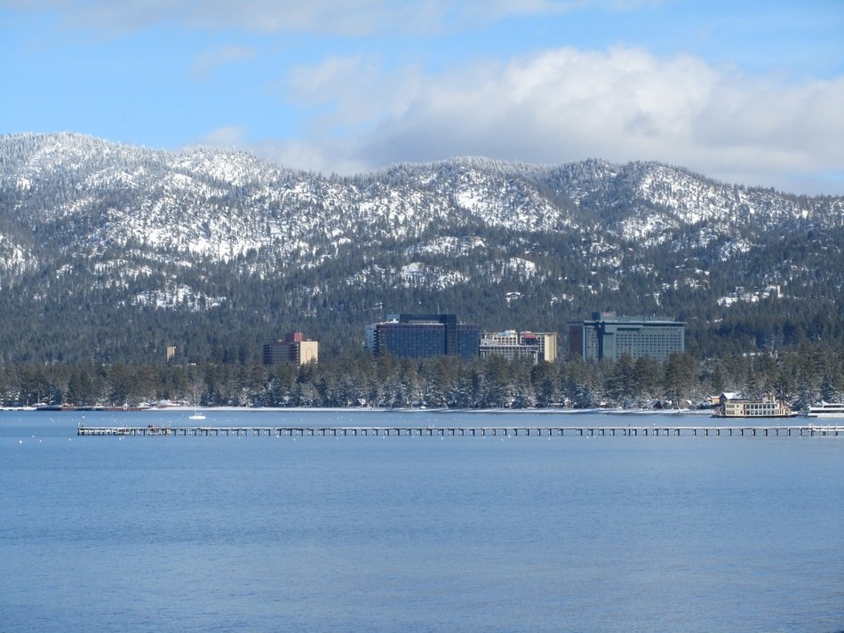 distant view of the coast of south tahoe lake in winter