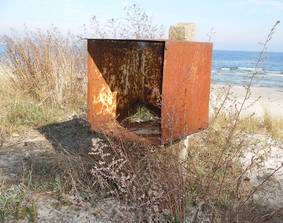 rusty shed on sandy beach
