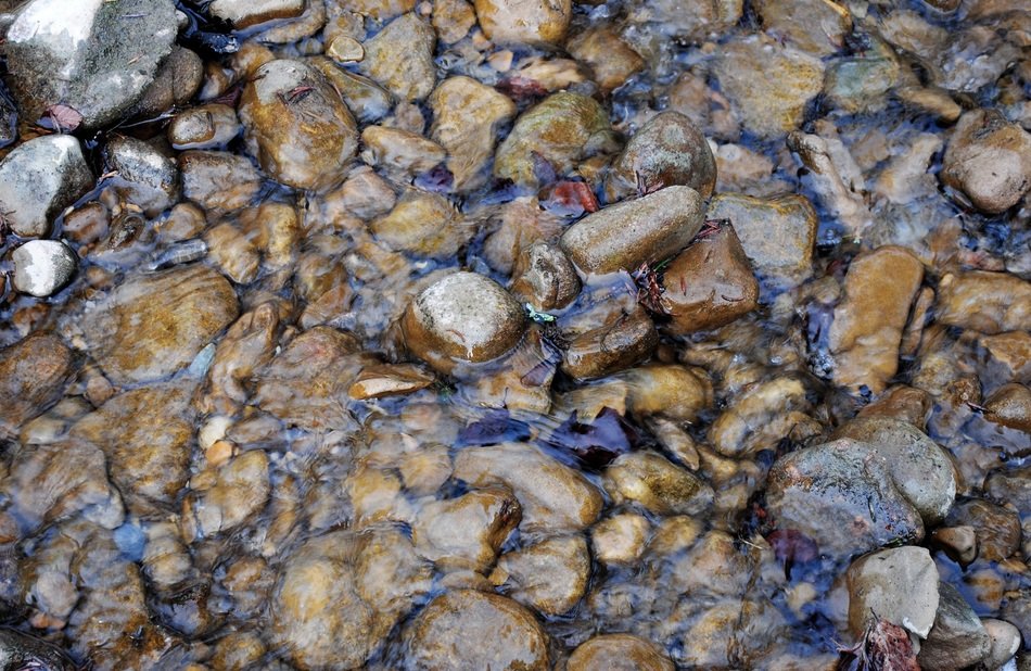 shiny stones under water