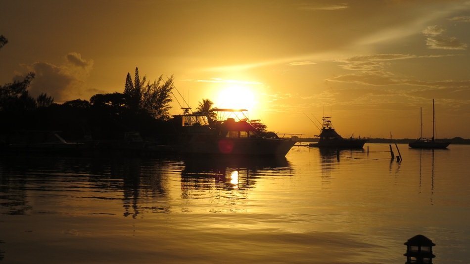 vessels on the lake at sunset