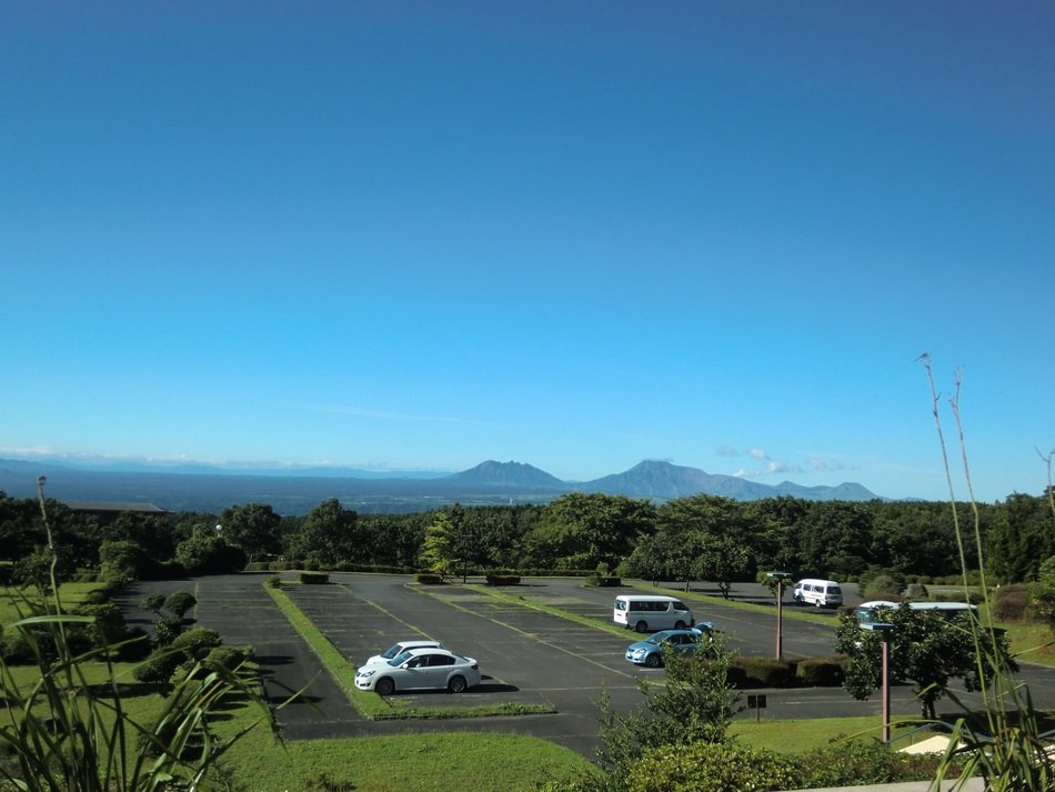vehicles on parking lot in tranquil landscape, japan