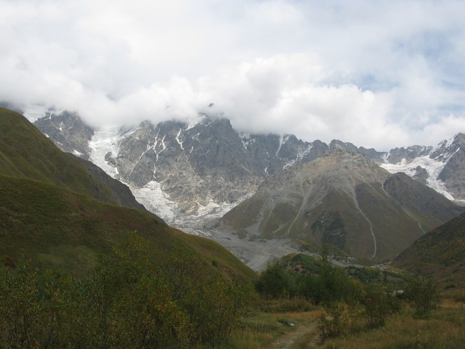 green mountains in clouds