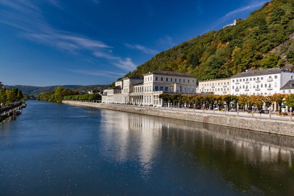 white buildings by the river
