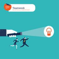 Hand with torch light showing the solution to businesspeople