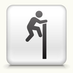 A white button if a business man climbing wall