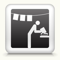 Square Button with Person Developing Photos in the Darkroom