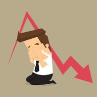 Sad businessman down arrow graph
