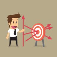 businessman throwing arrows at the target precisely goal of