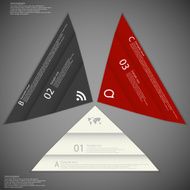 Three folded paper pieces on dark